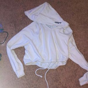 cropped sweater/sweatshirt with tyes at the bottom